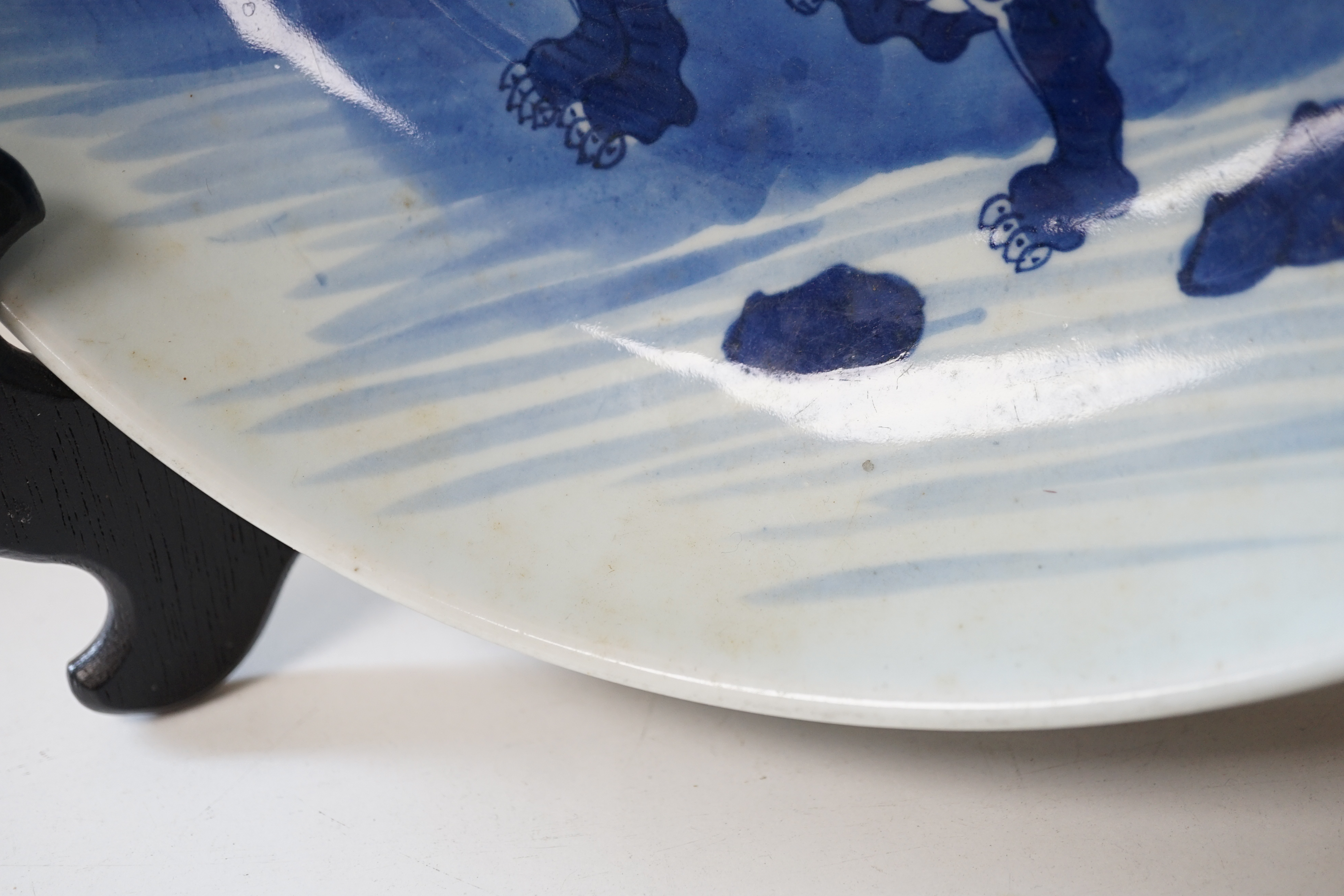 A large Chinese blue and white ‘mythical beasts’ saucer dish, Yongzheng period